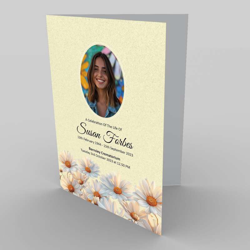 Funeral service program featuring a photo of a smiling woman, Susan Forbes, with 7.4 Red Roses Remembered and floral design elements.